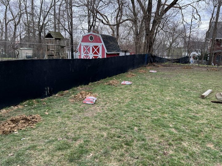 Old fence covered in plastic